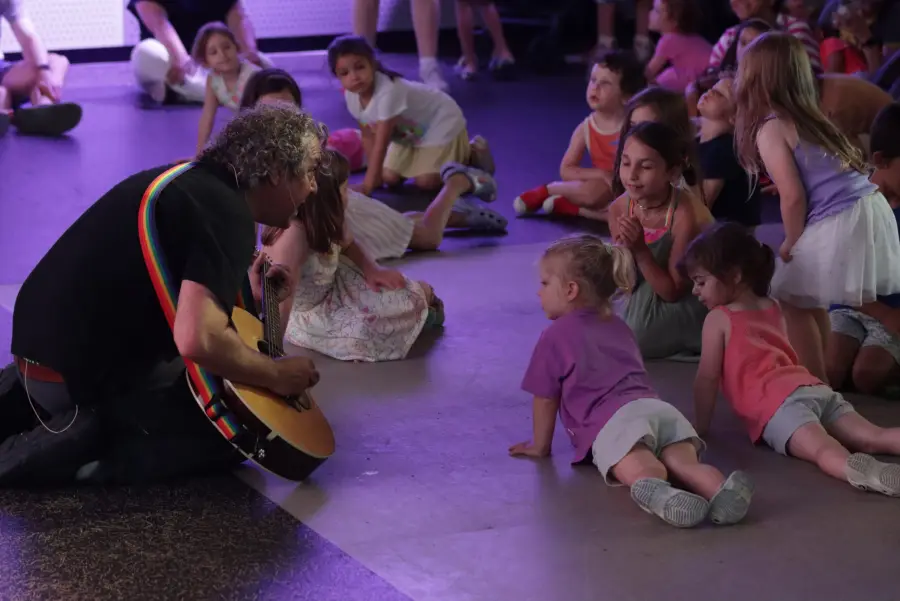 Michael performing for a large group of kids