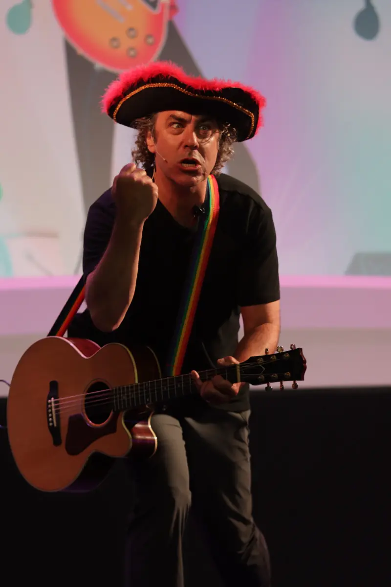 Michael performing with his guitar